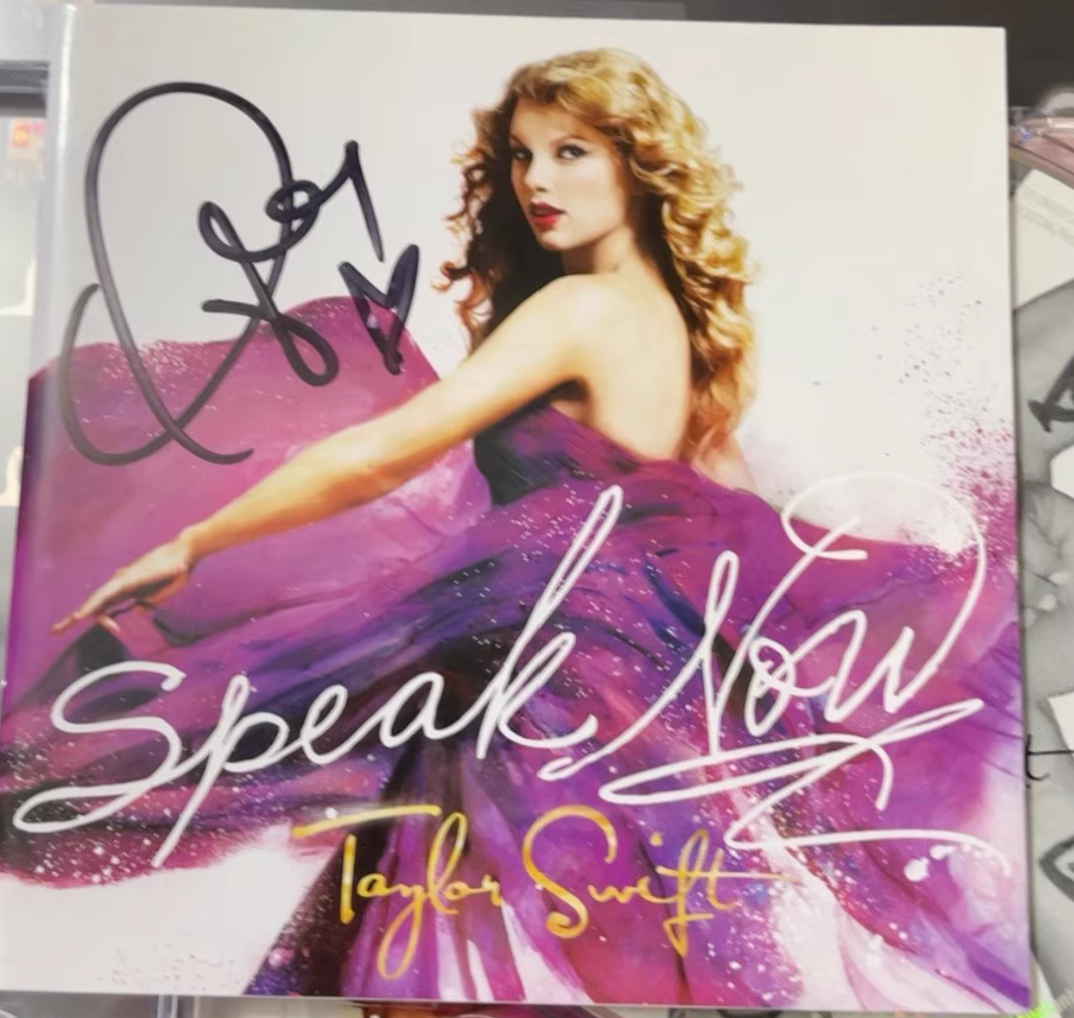 Taylor Swift signed CD (price as marked, condition as shown)