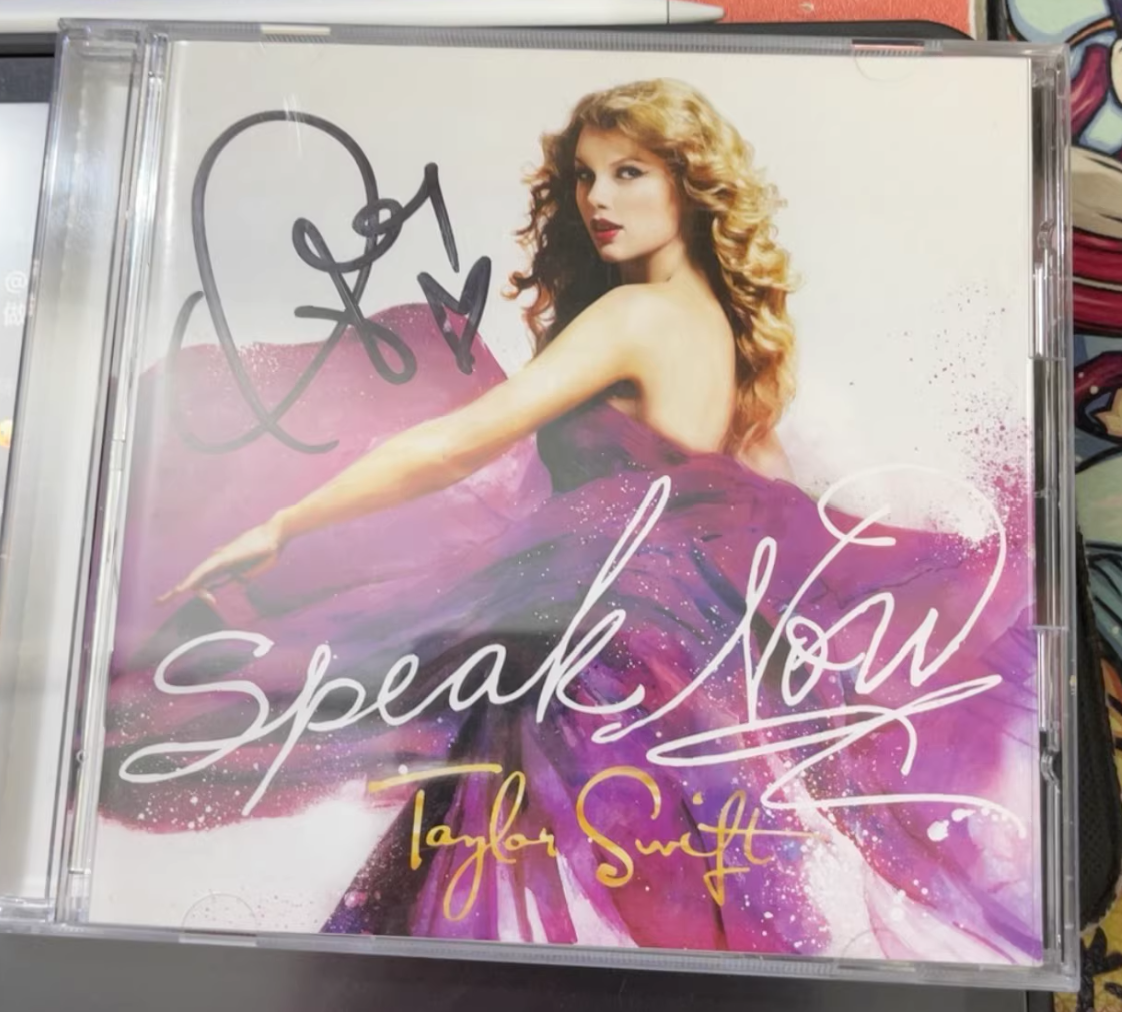 Taylor Swift signed CD (price as marked, condition as shown)
