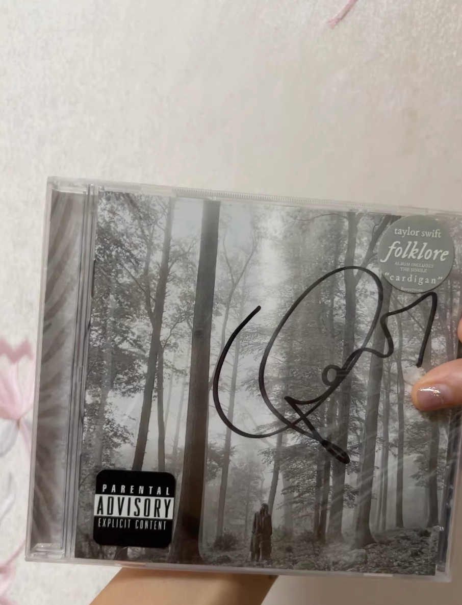 Taylor Swift – Folklore (Signed CD)   Signed CD edition of *Folklore*. Condition Mint (M): flawless, factory sealed, unplayed, with original stickers. Rare collectible.