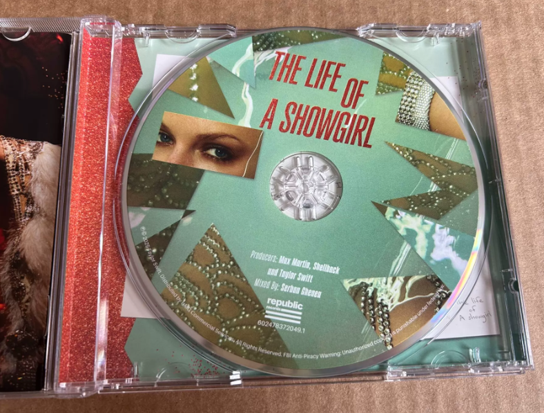 Taylor Swift – The Life of a Showgirl Signed CD Cover 1 – Heart Signature – Side Opened