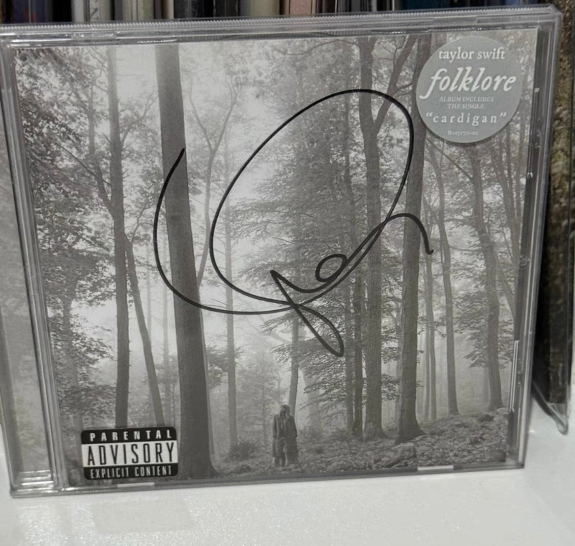 Taylor Swift Folklore signed CD (minor surface wear)