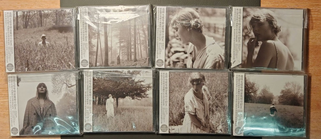 Taylor Swift Folklore CD - Condition as shown in photos, opened but well preserved, the full set, each includes a bookmark.