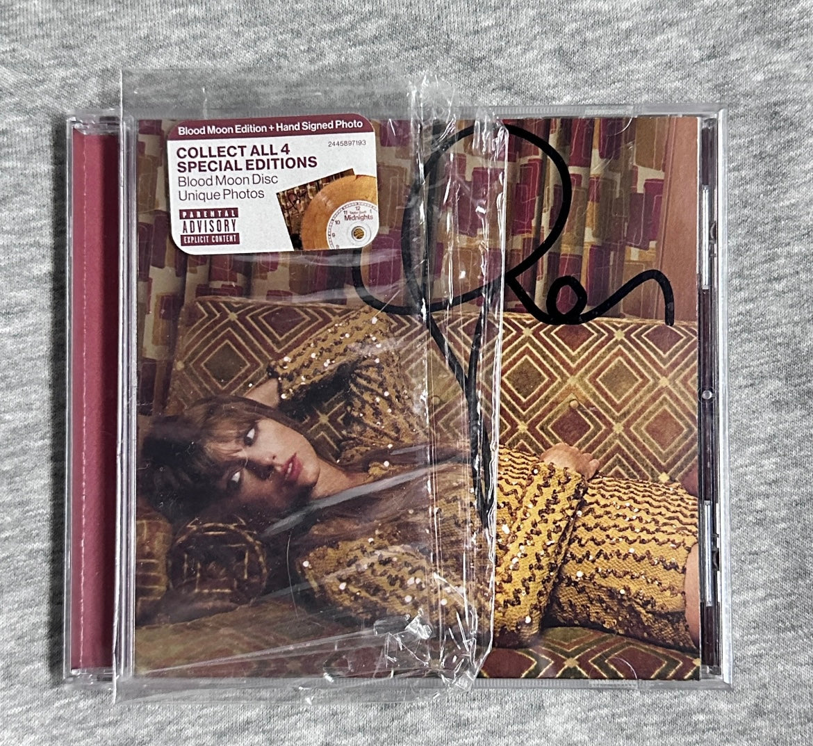 Taylor_Swift_Midnights_CD_with_Autograph_Blood_Moon_Edition
