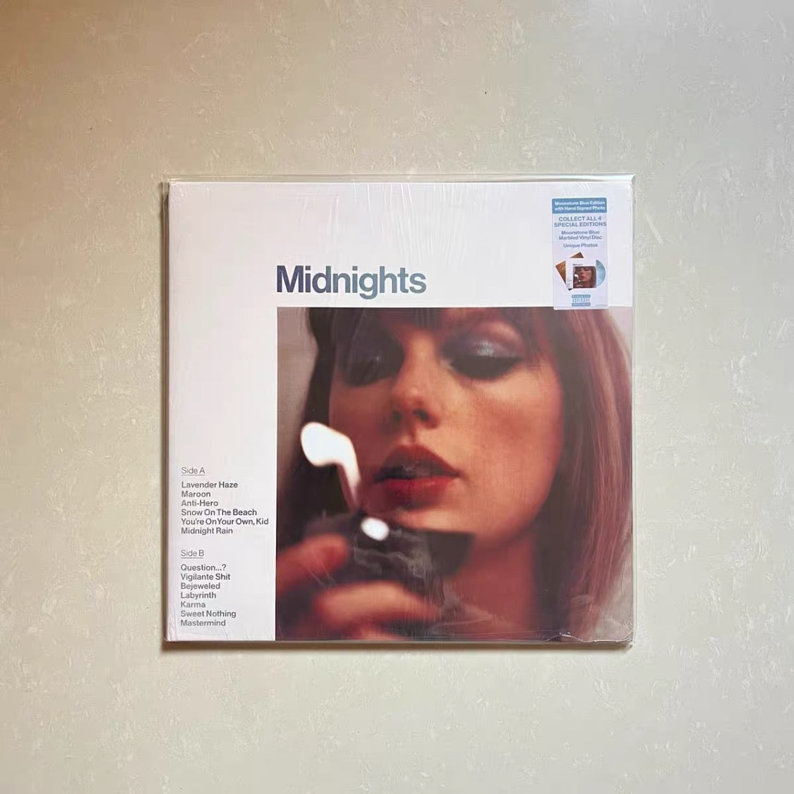 Authentic *Midnights* “Blue Moon” variant, hand-signed by Taylor Swift.