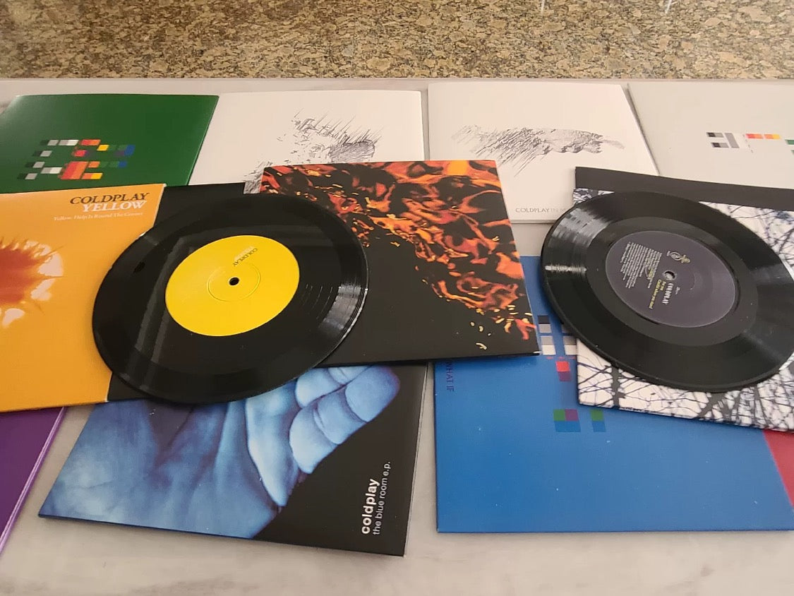 Coldplay 1999–2006 7-inch EP black vinyl box set, includes 14 records, played once, near mint condition, collectible European edition.