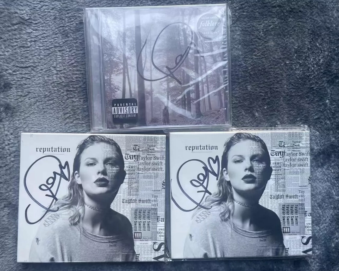 Taylor Swift signed CD bundle – includes *Folklore* and *Reputation* signed covers. All items NM. Price on request. Message for details.