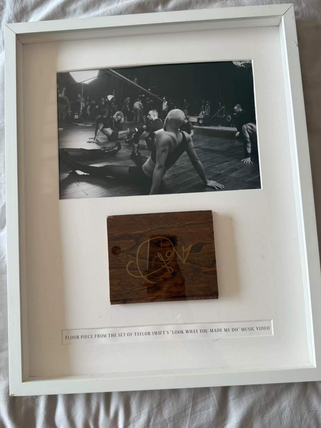 Taylor_Swift_LWYMMD_MV_prop_signed_board_damage