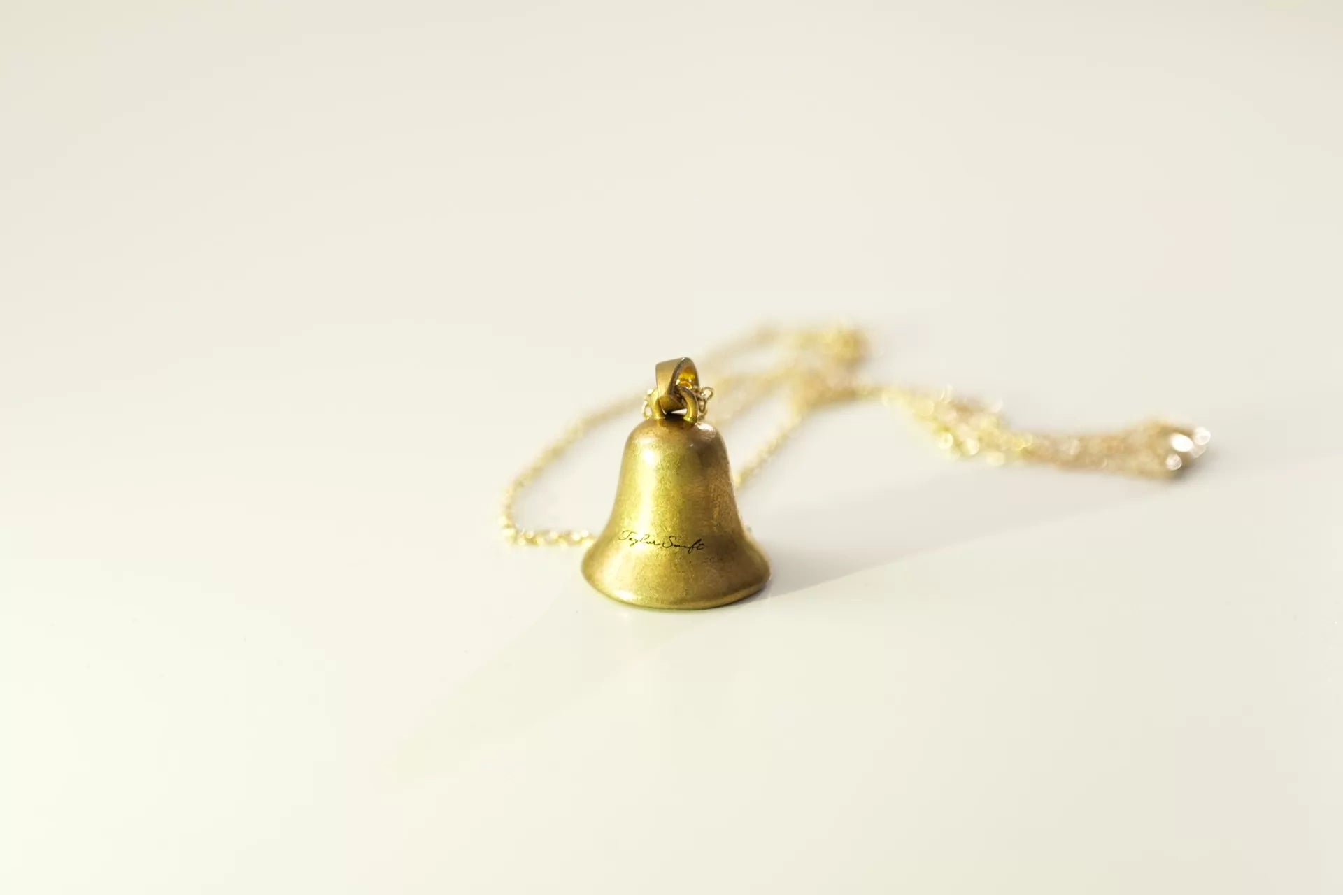 Taylor Swift Speak Now bell necklace detail