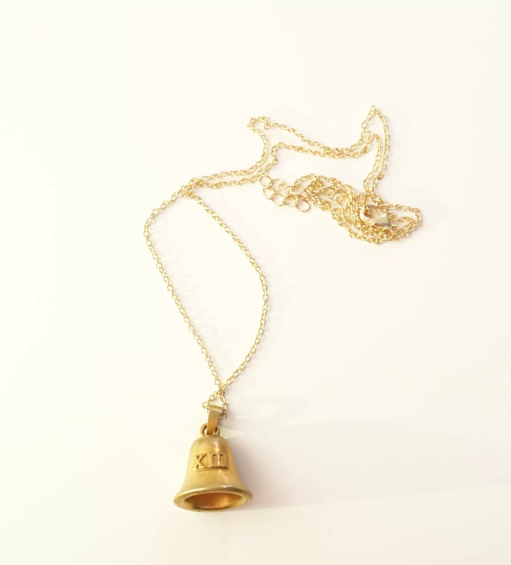 Taylor Swift Speak Now bell necklace close-up
