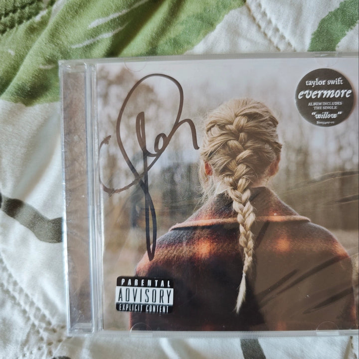 Taylor Swift – Evermore, Seller-Listed Signed CD with Ink Rubbing